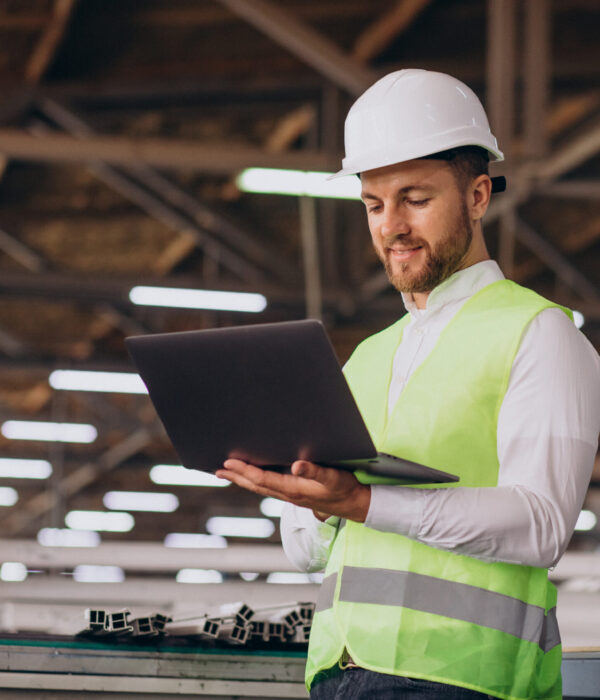 Young man engineer working on factory