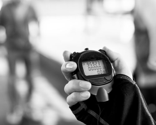 Closeup of hand holding stopwatch